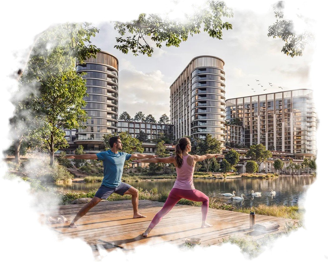 Residents practising yoga on a lakeside deck beside Sobha Sanctuary residences